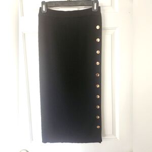 Slender black stretch skirt with gold buttons. Size small. NWOT